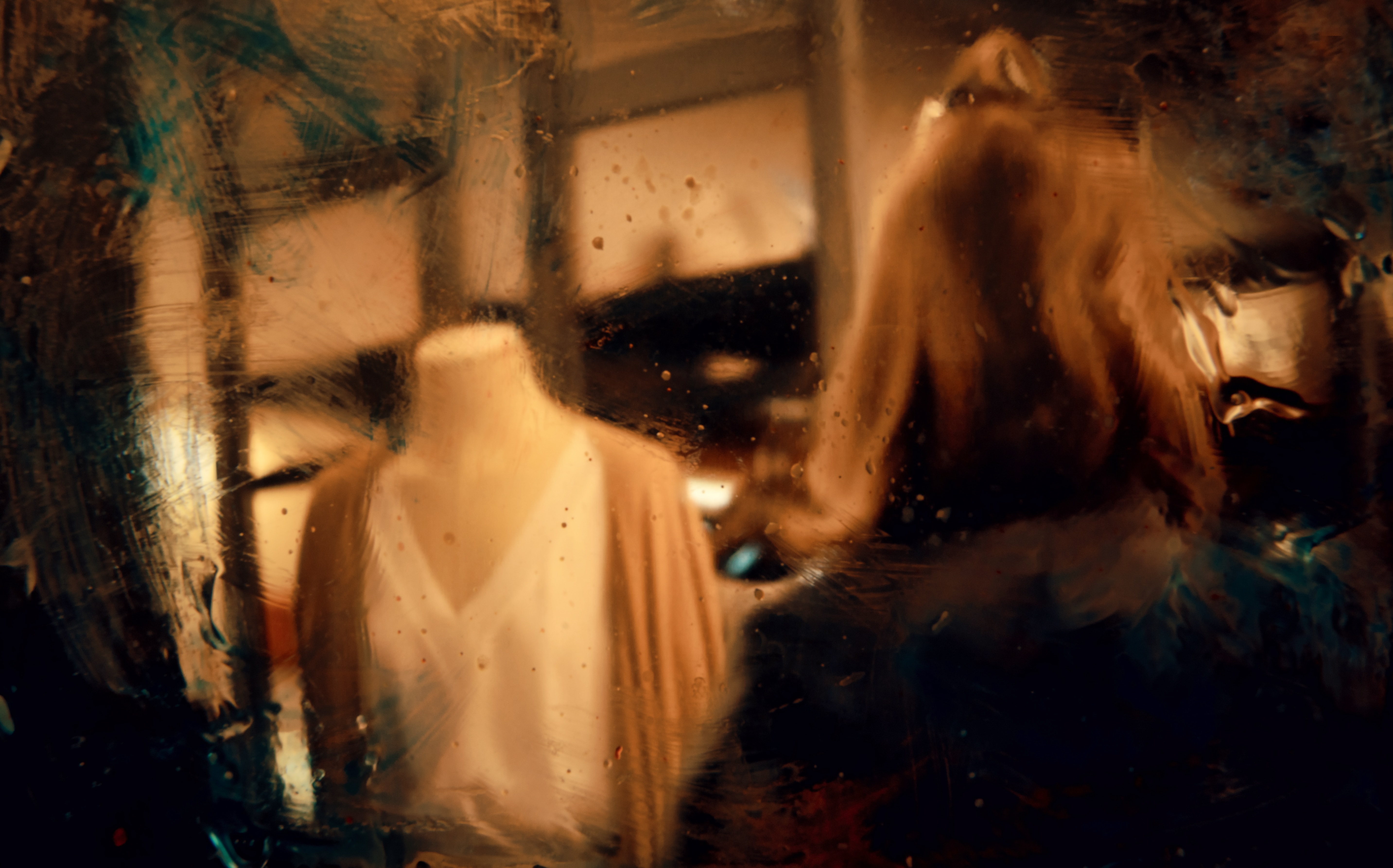 Sepia tone, textured photo of a shop mannequin wearing a white v-neck blouse and tan cardigan. Soft focus and blurred like a dream.